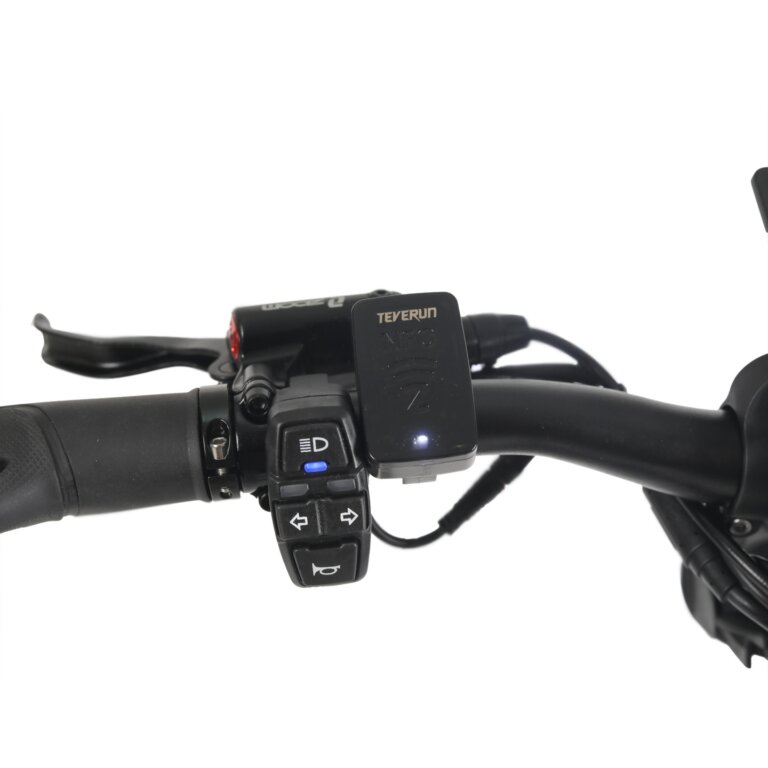 The handlebar of a Fighter 11+ motorcycle with remote control capabilities.